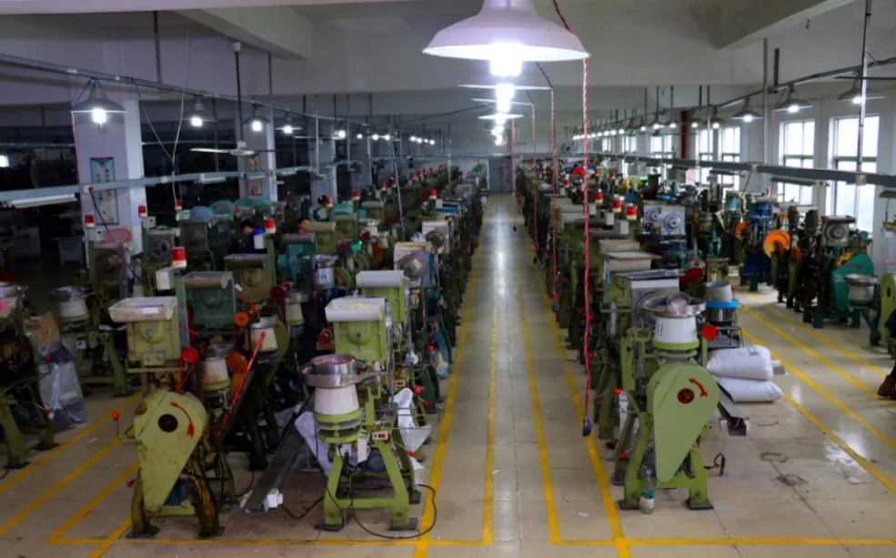 Rows of button presses on DC Button’s factory floor in Guangzhou